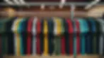 Eye-level view of a vibrant collection of screen-printed t-shirts hanging on a rack
