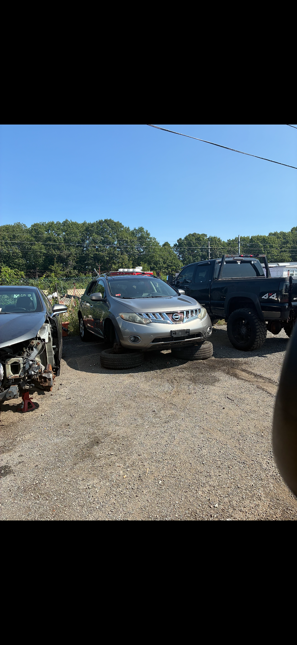 Silver SUV in a yard