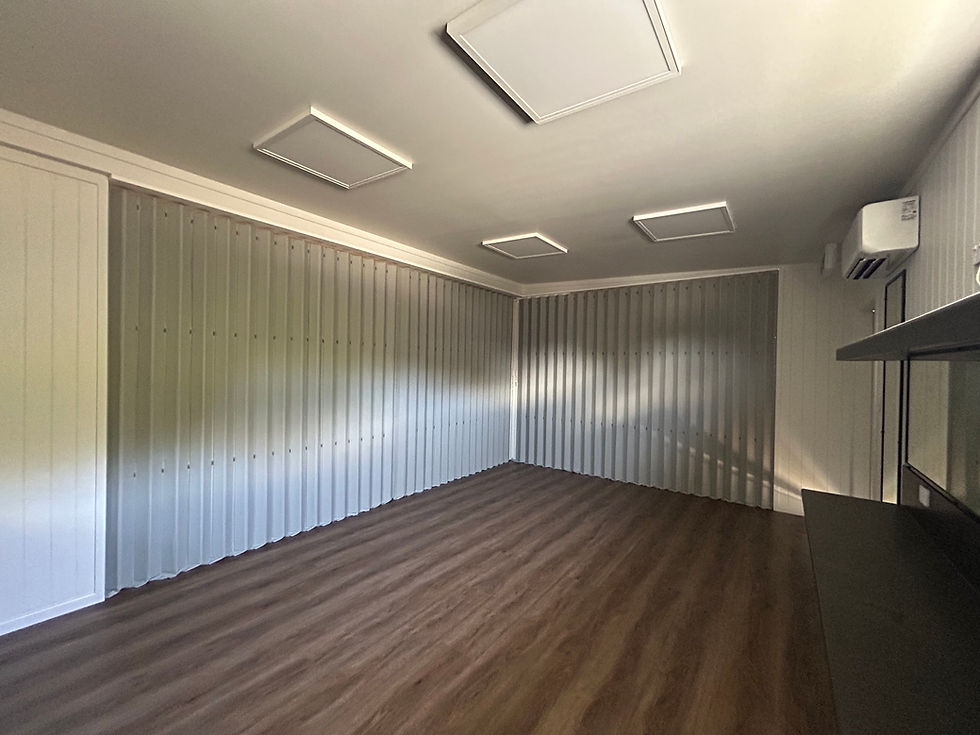 Large modular building divided into four changing rooms using commercial folding doors
