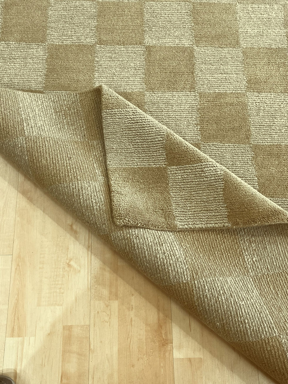 Thumbnail: Corner of Hand-knotted Tibetan area rug in beige checkerboard design.