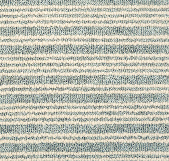 A close up of Stanton carpet Latitude in Blue Horizon, a soft blue and cream stripe. 