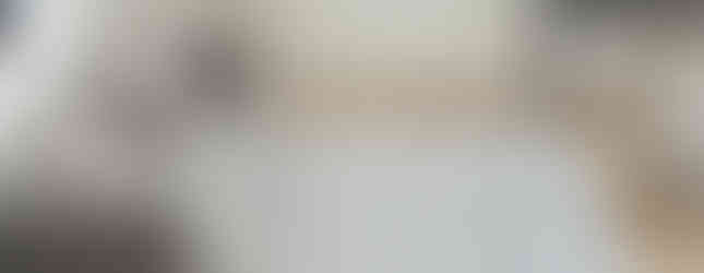 Striped blue and white wool carpet in a modern living room.