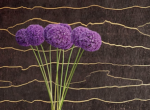 Close-up of Thibault wallpaper, organic streaks of gold over a mocha brown background.