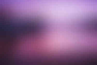 serene purple landscape scene with reflections on lake.