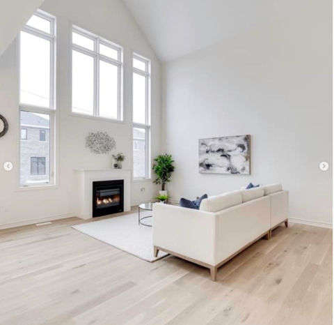 Luxurious white oak flooring installed in contemporary living room.