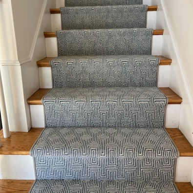 Grey geometric stair runner installed in a Boston home.