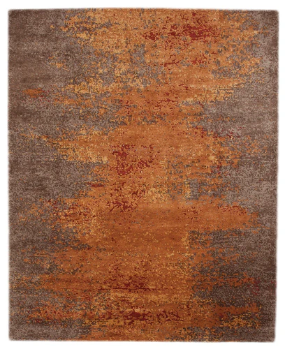 Beautiful hand-knotted Tufenkian wool rug in shades of brown and rust.