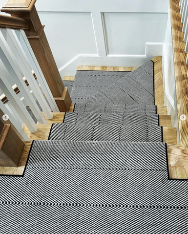 Kaleen herringbone striped carpet installed as a runner on stairs in Boston.