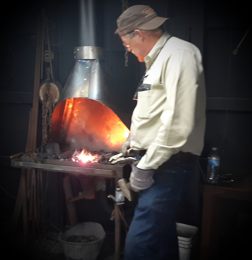 Nathan is getting his stock up to forge tempurature at LLForge Learn to Forge Airbnb experience