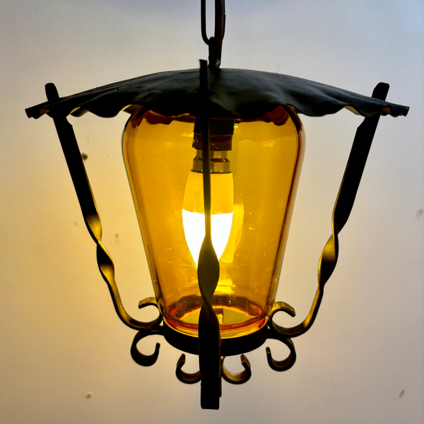 Mid-Century Wrought Iron Lantern Pendant with Amber Hand Blown Glass Shade.
