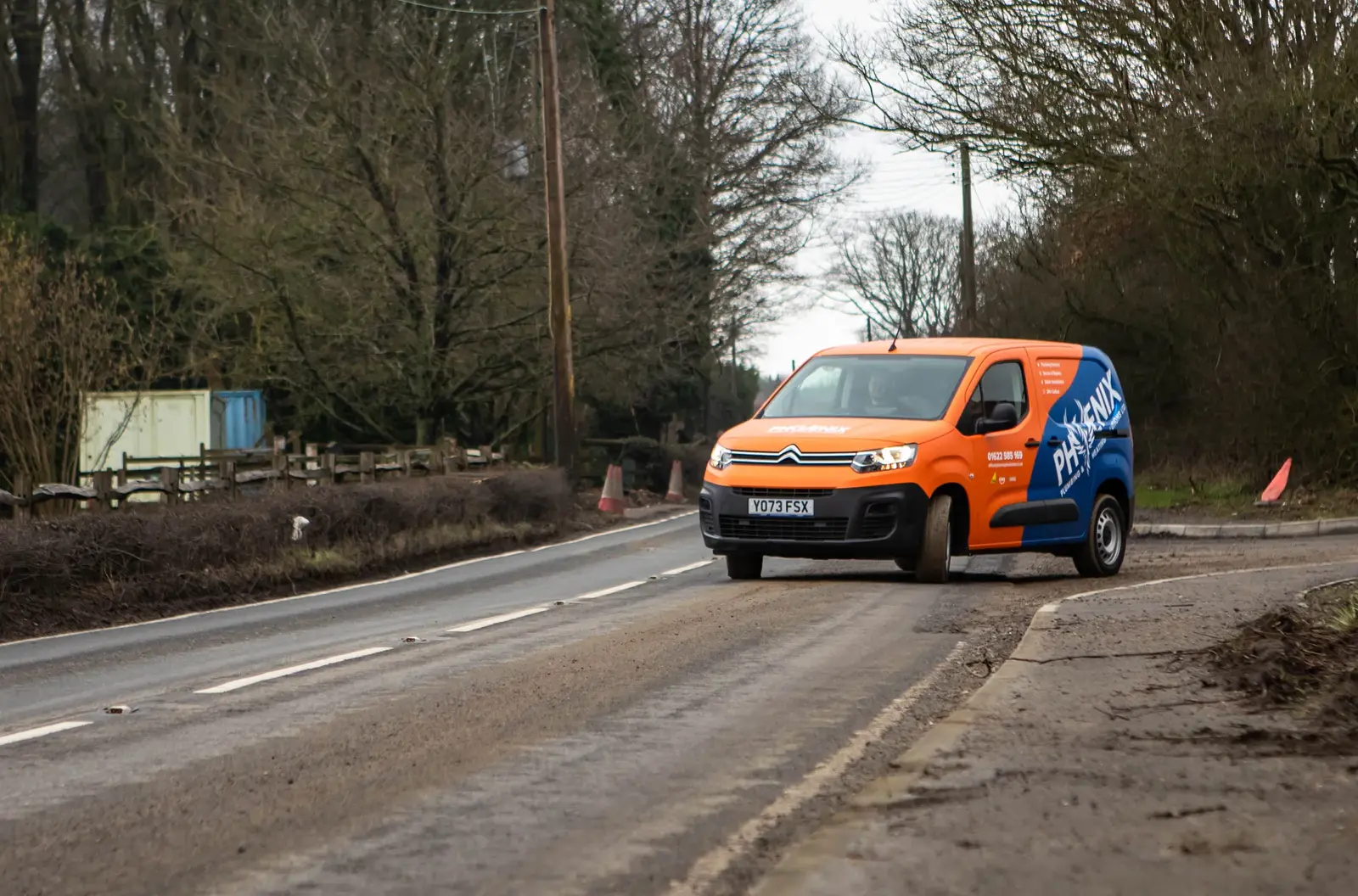 Boiler Installation in Rochester: orange and blue Phoenix Plumbing & Heating van driving along a Kent country road