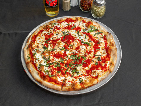 Pizza with tomato sauce, mozzarella, and basil