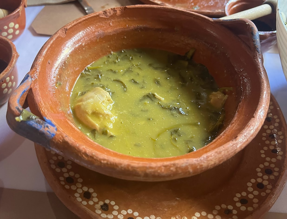 Our Pollo con Verdolagas en Salsa Verde de Miltomates: Chicken in Miltomate Green Sauce with Purslane greens, accompanied with white rice and slow-cooked beans on the side