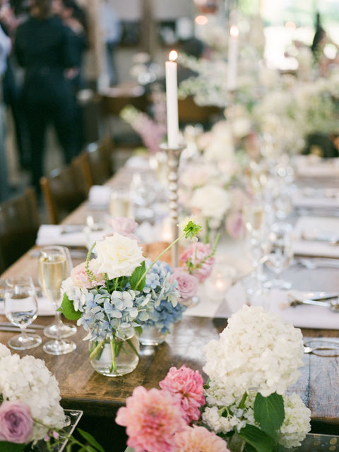 Pretty spring colour table flowers in bud vases