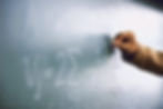 Teacher Writing a Formula on a Blackboard_edited.jpg