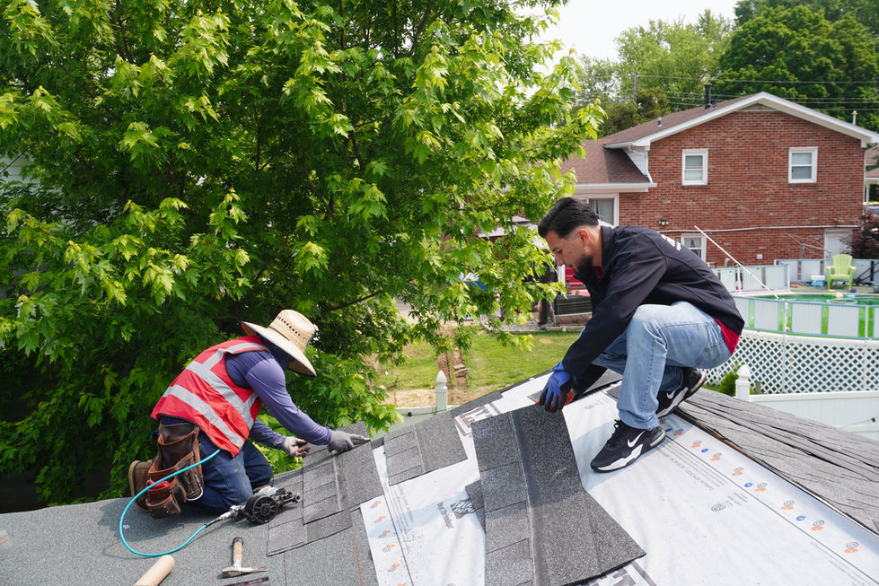 Workers performing roof replacement