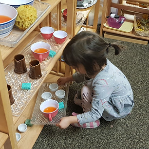 Girl playing with tea set