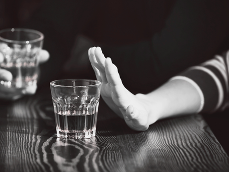 A hand saying no to another alcoholic drink