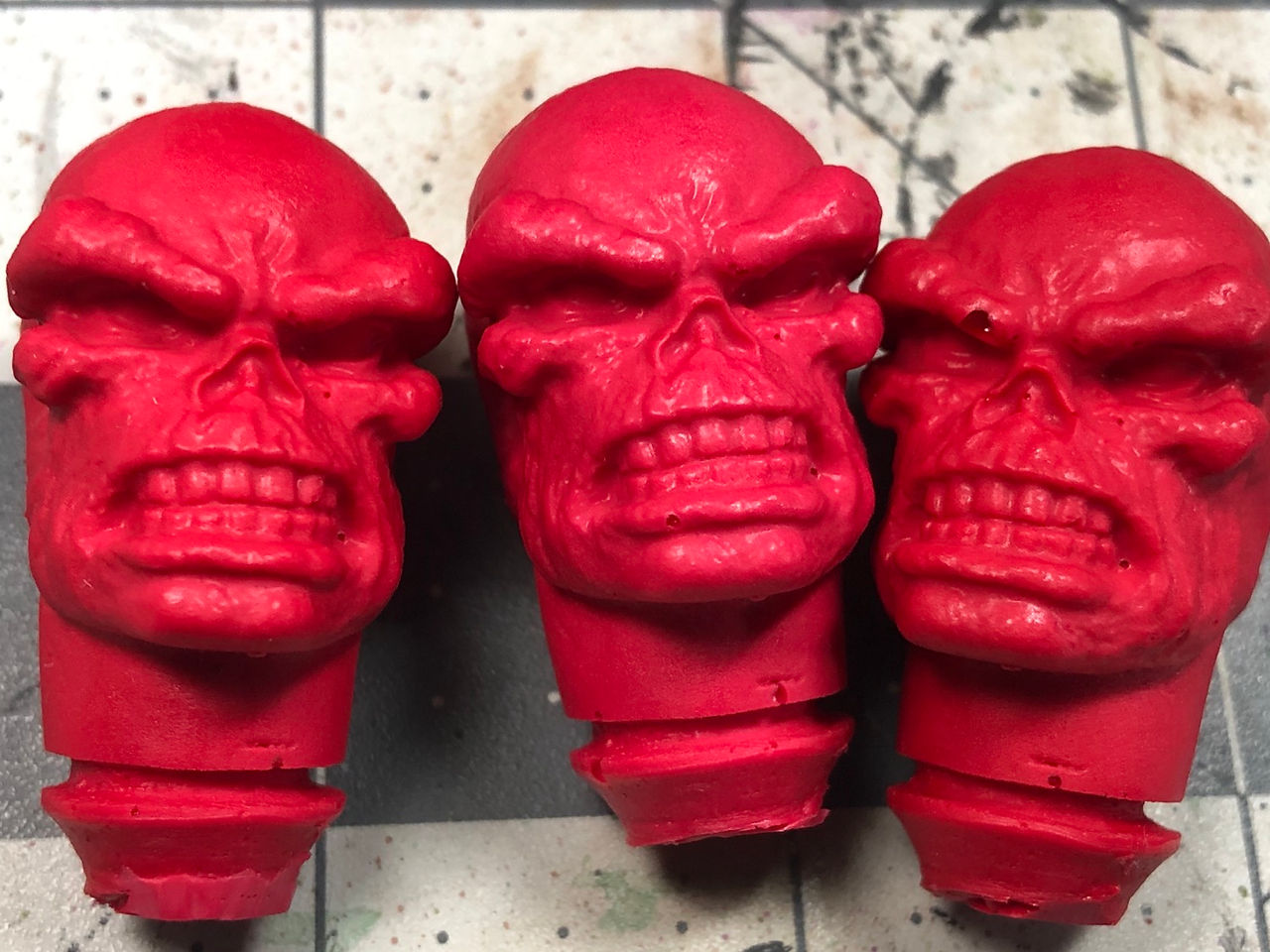3 cast mego red skull heads