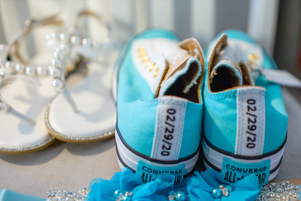 Custom bridal Converse shoes and pearl jewelry flat lay for SWFL wedding photography.