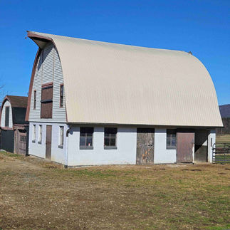 Nearby barn building