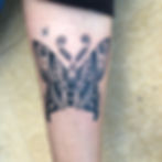 Ornamental butterfly tattoo by Southern California tattoo artist Tommy Borboa