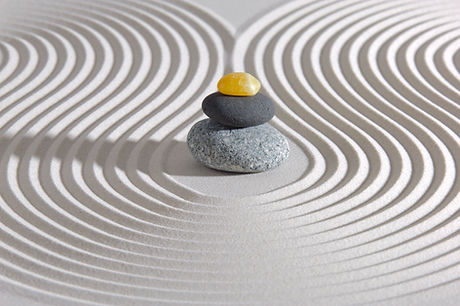 Stacked stones in sand.jpg