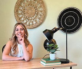 Best Santa Cruz real estate agent Ace Woods sitting at boho desk