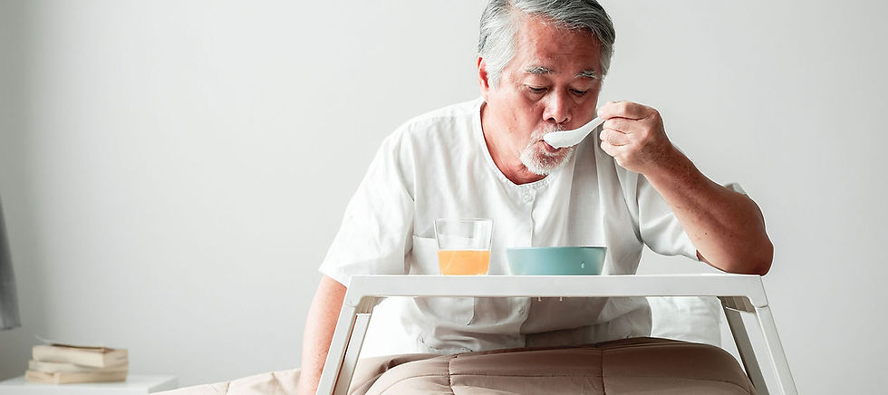 Elderly gentleman eating soup