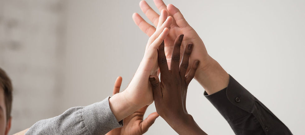 Several hands high fiving