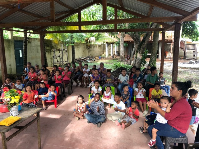 Children gathered for worship and praise.