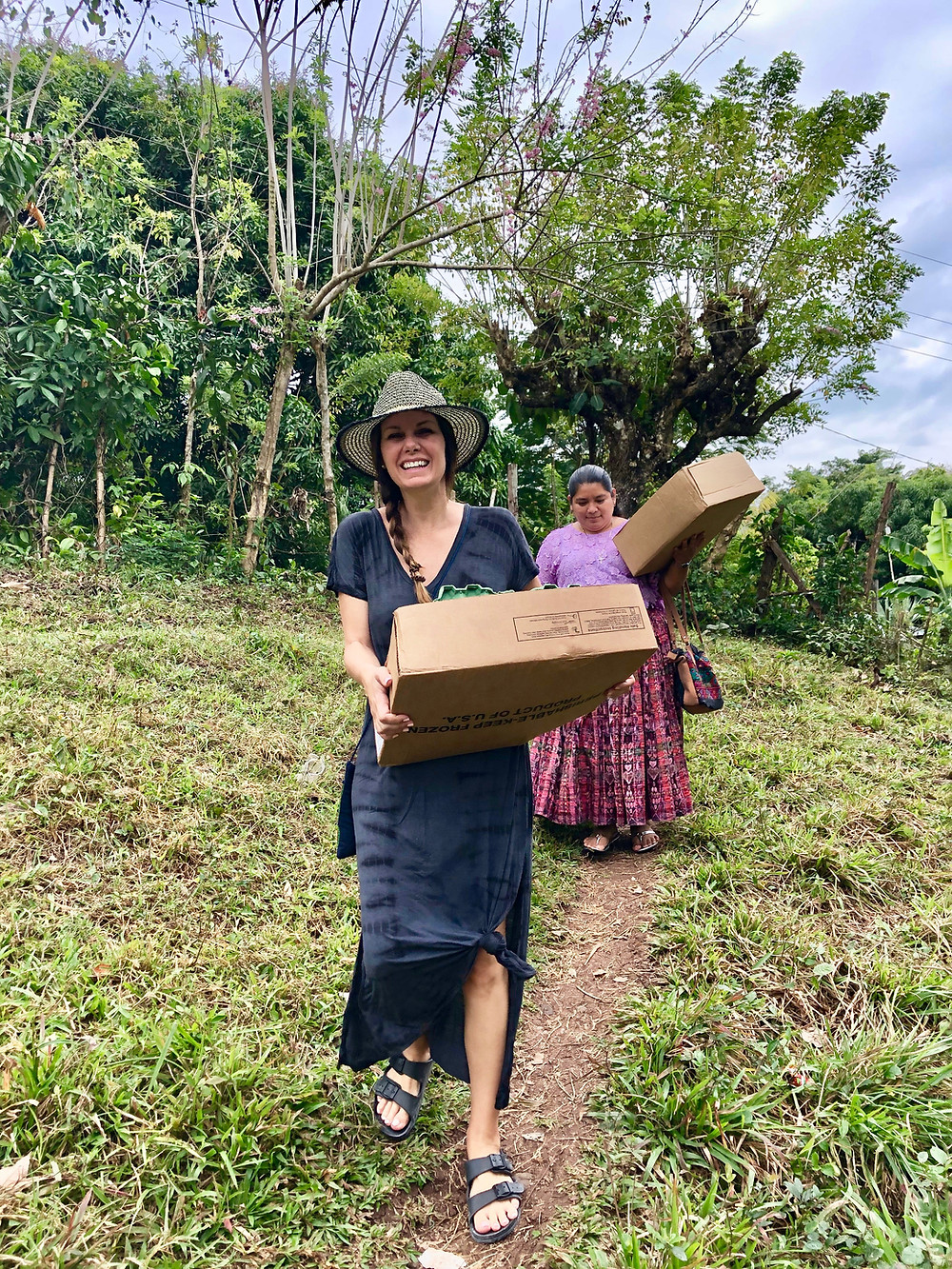 M'Leigh Lange joyfully delivering Manna Packs!