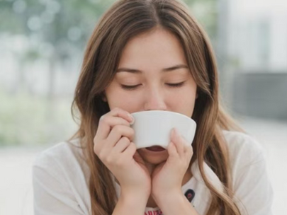 Woman drinking hot wellness tea as a natural home remedy for colds