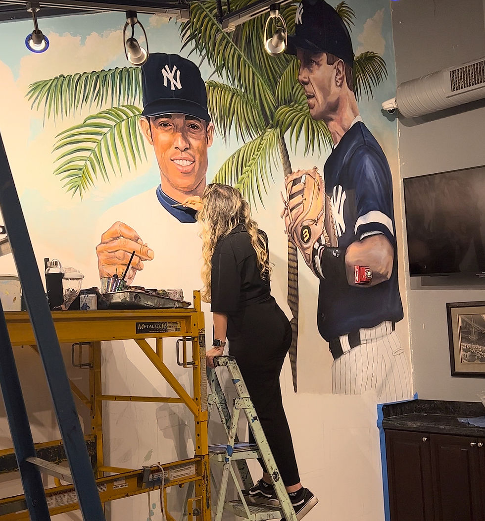Claudia Mattias working on New York Yankees mural at Steinbrenner Field Tampa FL