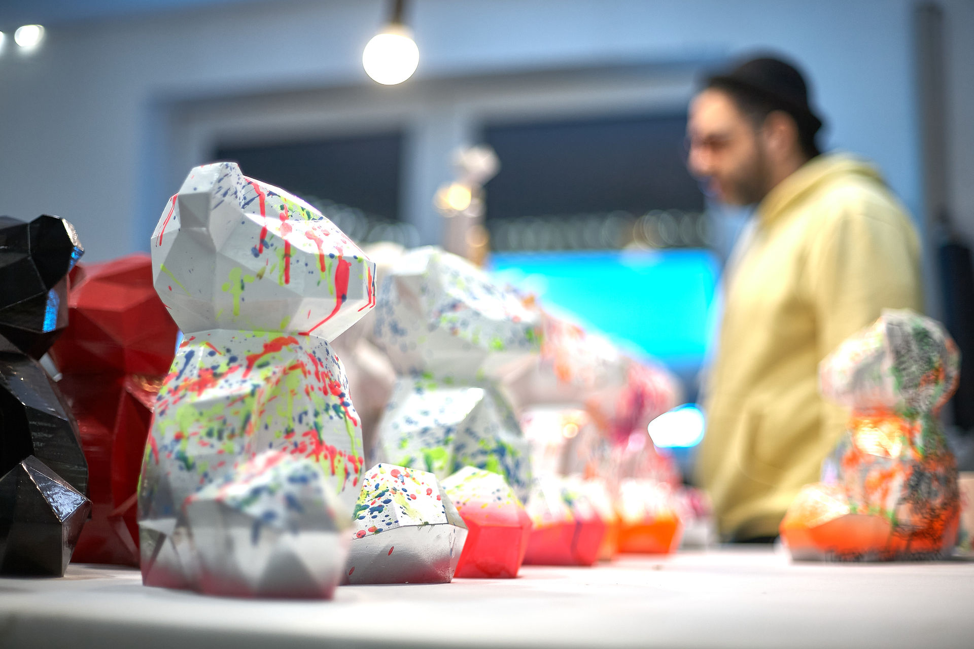 Artist Ylan Anoufa painting his Anoufa Bear