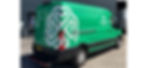Green van with white Clover Group logo parked outside a building. Visible text includes logistics services and contact info on the side.