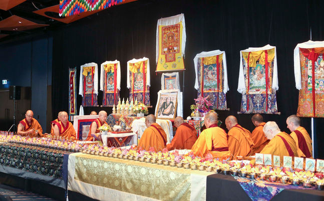 Sangha on stage for a prayer session on the second day of the Great Prayer Festival.