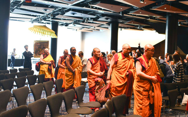 Opening ceremony procession for the Great Prayer Festival inviting His Holiness the Dalai Lama and sangha on stage.