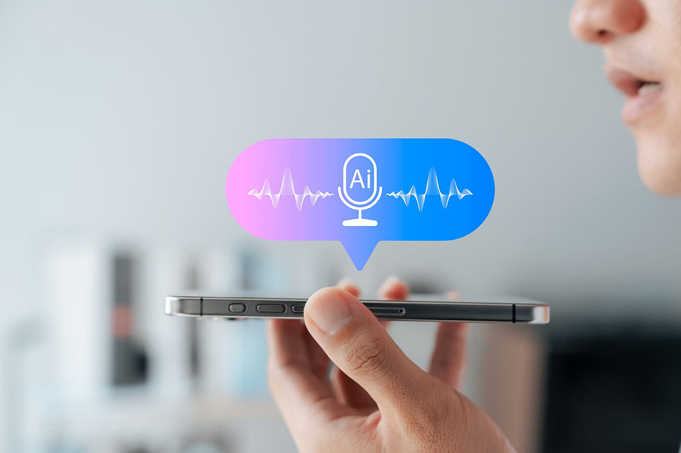 Person speaking into smartphone with AI speech icon above. Blue and pink background, waveform and "AI" text, indoors.