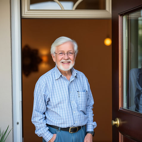 Smiling senior man standing at doorway