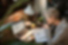 female-professional-working-from-home-studying-financials-on-desk.jpg