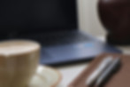 wfh-setup-laptop-coffee-notebook-cactus-on-desk.jpg