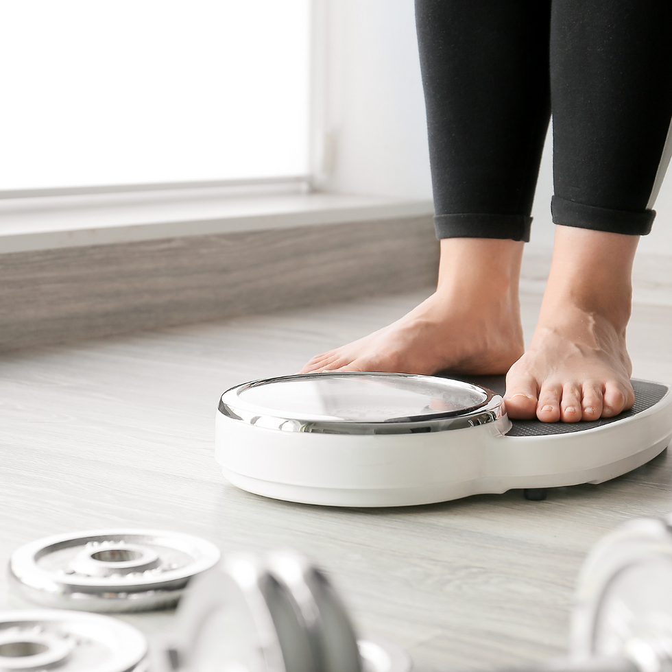 how hormones affect weight gain. women standing on scale