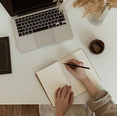 flatlay-womens-hands-writing-notebook-260nw-1917250406_edited.jpg