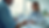 Close-up view of a patient and doctor discussing health charts in a bright clinic room