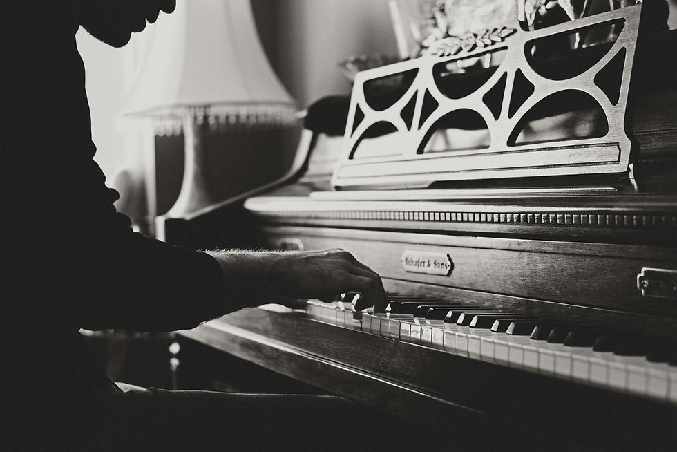 An independent artist playing the piano