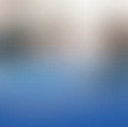 a woman explaining financial paperwork to a couple