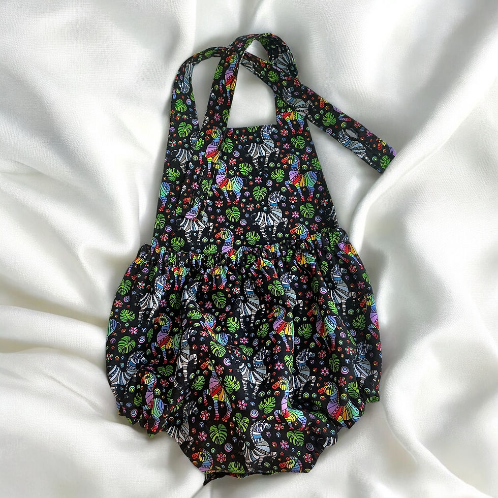 Thumbnail: Baby Romper with straps in a Vibrant Zebra and floral print in rainbow colours and black background