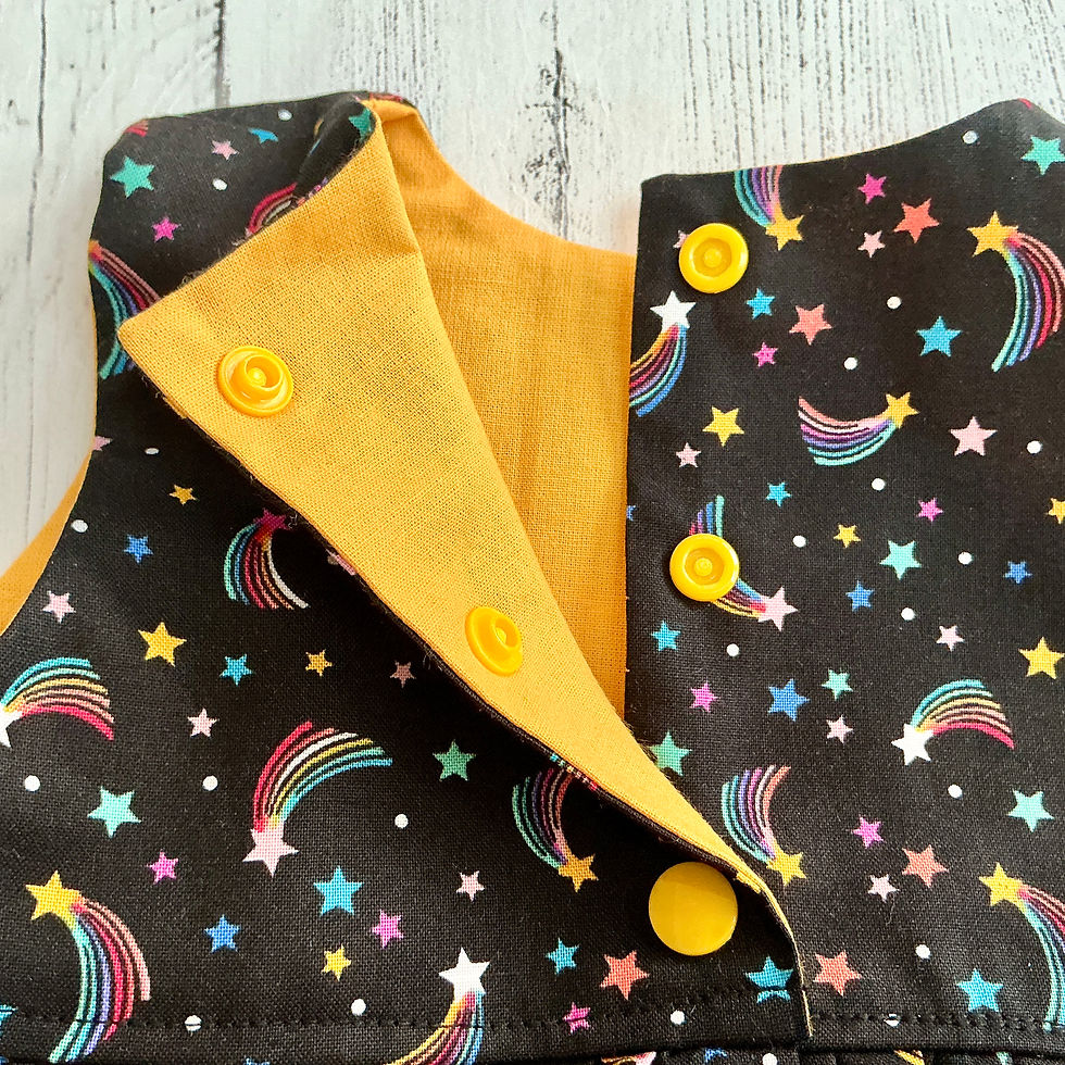 Thumbnail: Girls Rainbow Shooting Stars on black Sleeveless dress showing lining of bodice