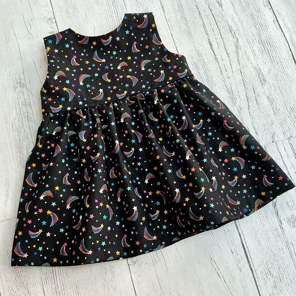 Girls Rainbow Shooting Stars on black Sleeveless dress flat lay front view